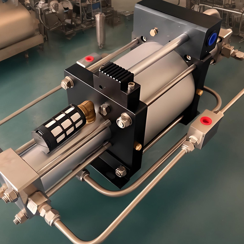 What causes the outlet pressure to drop when the compressed air booster pump is started?